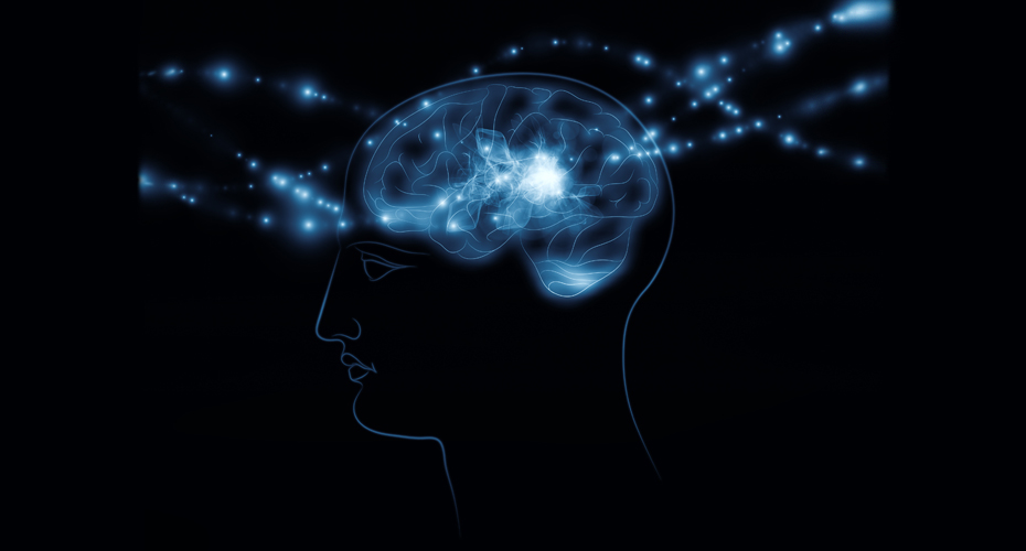 Illustration of a human head in profile with a glowing blue brain at the centre, emitting bright streams of light and particles that radiate outward against a dark background, symbolising thought, intelligence, memory, or artificial intelligence.